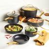 imageFarberware Forged Induction Ceramic Nonstick Pots and Pans Set with Lids and Kitchen Cooking Tools  Dishwasher Safe Suitable for All Stovetops 12 Piece Cookware Set  Black and Gold