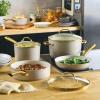 imageFarberware Forged Induction Ceramic Nonstick Pots and Pans Set with Cooking Tools Dishwasher Safe Gold Color Stainless Steel Handles 12 Piece Cookware Set  TaupeTaupe